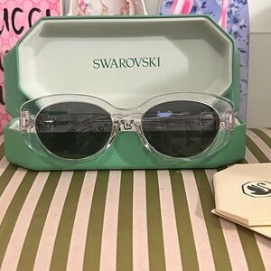 Swarovski Clear Oval Sunglasses with Dark Gray Lenses